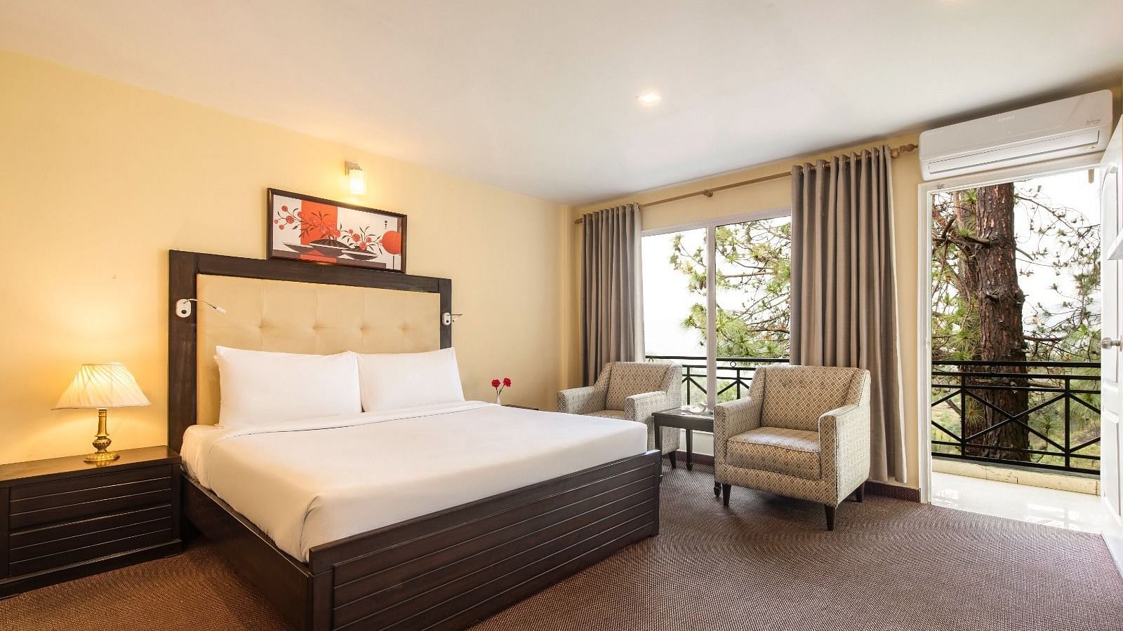 Super Deluxe Room with a king-sized bed, cosy seating area, and a large window offering natural light and scenic views | ZENQ MAPLE RESORT, CHAIL